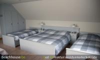 drie bedden op de kamer