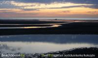 zonsondergang op het strand van odk